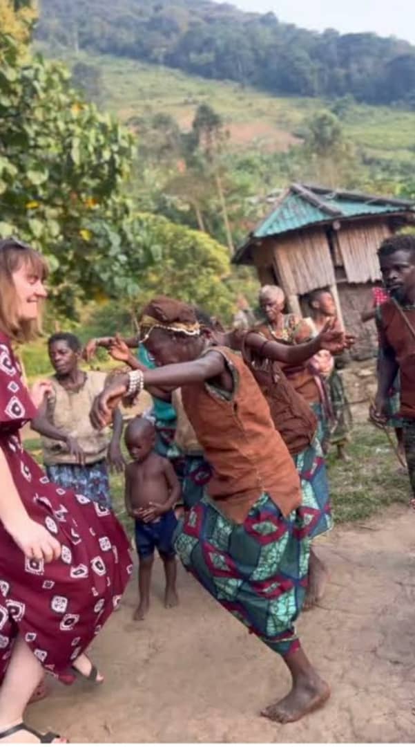 Tourist with Batwa community members